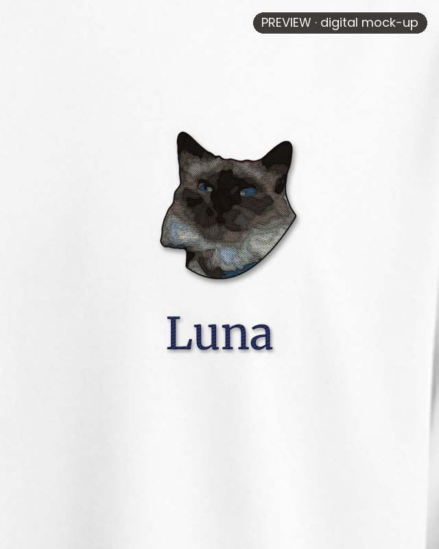 Preview: an embroidered colourpoint cat's head on the left chest of a white oversized T-shirt, with the name Luna stitched in navy